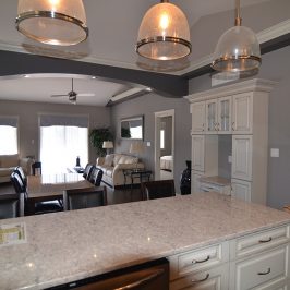 Custom kitchen and living room with granite countertops in Peterborough, Ontario